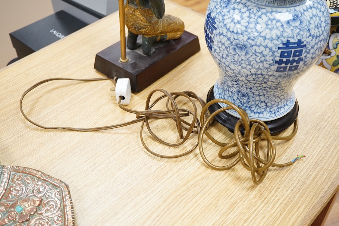 A Chinese blue and white ‘shuangxi’ vase and cover, mounted as a lamp, together with a lamp mounted with a bronze Thai figure, largest 50cm high including light fitting